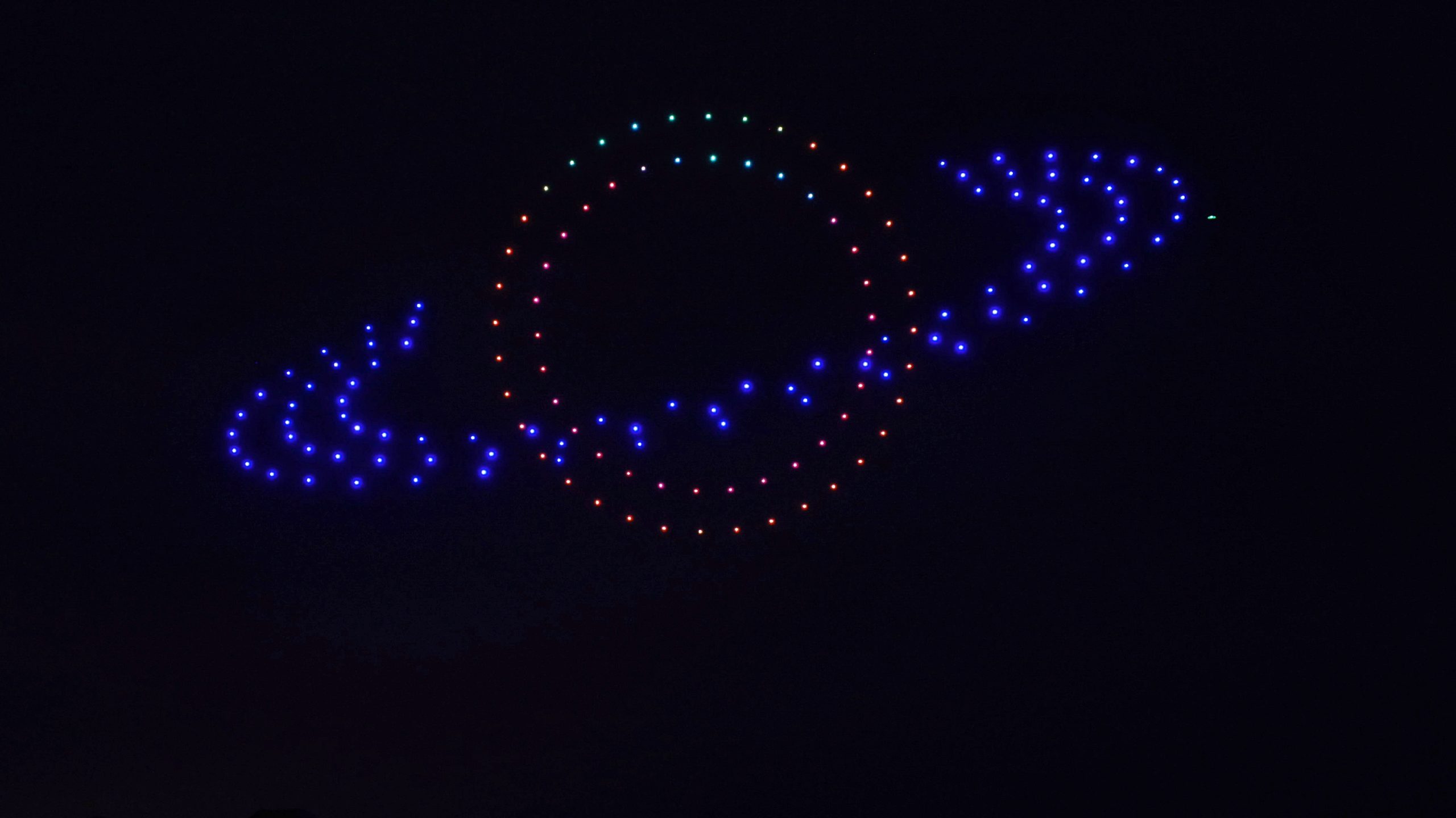 Skyrunner Shows drone fleet creating aerial light formation at dusk over California venue